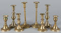 Four pairs of English brass candlesticks