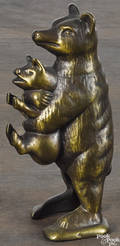 Cast iron bear stealing pig still bank