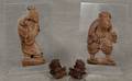 Pair of Chinese carved wood figural plaques of a man and woman