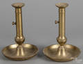 Pair of brass pushup candlesticks with drip pan bases