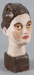 Painted plaster sculpture of a womans head