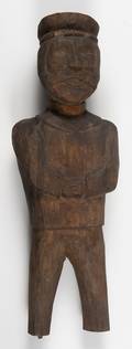 Folk art carved figure of a uniformed man