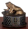 J  E Stevens cast iron frog on lattice mechanical bank