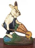 Cast iron rabbit pushing cart door stop