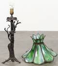 Welded metal treeform table lamp with a green slag glass shade