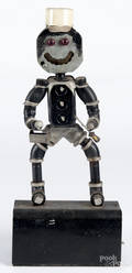 Folk art figure constructed from pipe fittings