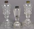 Three clear glass whale oil lamps