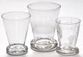 Three blown colorless glass drinking vessels