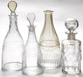 Three tapered glass decanters