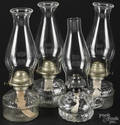 Four glass kerosene lamps