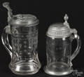 Two German or Swiss pewter topped etched glass steins