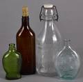 Four assorted glass bottles