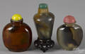 Three Chinese carved hardstone snuff bottles
