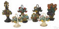 Eight painted cast iron figural flower doorstops 20th c