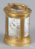French miniature brass carriage clock with painted porcelain fulllength portraits of young girls on either side