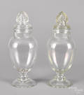 Pair of colorless glass urnform covered apothecary jars