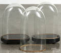 Three glass clock domes