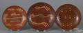 Three Pennsylvania slip decorated redware plates