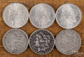 Six Morgan silver dollars