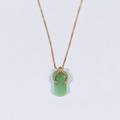 A 14k Gold and Green Jade Pendant