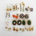 Fifteen pairs 2oth c earrings includes diamonds pearls peridot carved coral paste and a pair of cartier 18k yg and blue enamel dome earrings post screw and hinged shepherds wire backs 10