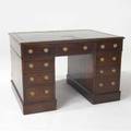 Partners campaign desk in solid mahogany the top fitted with three drawers to each side the pedestals each with three drawers in the front and one side door 31 x 48 x 35