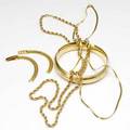 Gold jewelry in 14k and 18k yg includes a hinged bangle two chains and a bracelet broken 704 gs gw