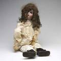 German bisque head doll impressed mark a b 1362 on back of head together with a bag of dolls clothing 32 tall