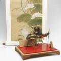 Asian papier mache and paper dragon held aloft by poles facing a flaming pearl with two wooden tablets with calligraphy in a fitted display case together with remounted scroll with cranes and lotus