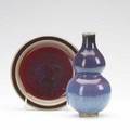 Chinese ceramics two chinese monochromes a double gourd vase with mottled purple to blue glaze and a plate with oxblood and green glaze 19th century 7 14 and 6 34 dia