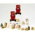 Japanese netsuke and chinese snuff bottles group lot including fourteen ivory netsuke some with stained detail five snuff bottles in fitted box one green hardstone snuff bottle two resin foo dogs