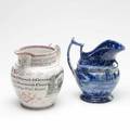 Sunderland luster pitcher with transfer decoration dated 1840 together with a staffordshire blue and white pitcher in poor condition sunderland 8 12 x 7 14