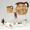 Royal doulton seven pieces the pearly boy four figures of dogs and two character mugs one large one small largest 6 38
