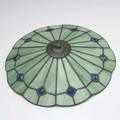Art glass lamp shade parasolshaped leaded art glass shade of green slag glass with blue glass jeweled accents 16 dia