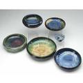 Fulper six pieces five low bowls in various glazes and a lily padshaped flower frog marked largest 10 12 dia