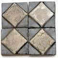 Grueby forty 2 tiles with ivory diamond design on a glossy black ground unmarked
