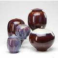 Tom turner five porcelain vessels covered in oxblood and purple glazes all signed tallest 9 12 x 5 12