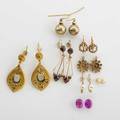 Gold earrings and earring fragments six pairs portuguese 14k yg earrings accompanied by a pair of synthetic pink sapphires early victorian 14k yg and foil backed garnet earrings faceted 10k yg