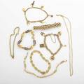 Seven yellow gold bracelets and a neck chain includes fancy and woven links charms and enamel one tiffany  co 14k18k yg and pink gold longest 18 earlylate 20th c 627 dwt property from