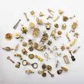 Sixtythree novelty yellow gold charms includes domestic hat and utensil charms some mechanical etc 9k22k 626 dwt gw property from the collection of gray davis boone