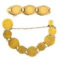 Two high carat gold coin bracelets 18th c yg ducats two and a half pesos dated 1945 coins at least 20k yg mounted and joined as bracelets in 14k yg 7 443 dwt