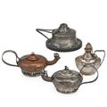 Four arts  crafts silver strapped cigar lighters silver spot hammered by shreve crump and low in aladdin style monogrammed jfh copper and sterling by bailey banks  biddle spot hammered and riv