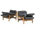 Sergio rodrigues b 1927 isa pair of sheriff lounge chairs italy 1970s teak leather metal manufacturer label 31 x 33 x 34