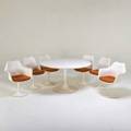Eero saarinen knoll associates tulip dining table and six chairs two arm four side new york 1970s enameled metal painted fiberglass laminate table 28 12 x 53 12 dia armchair 31 12