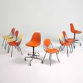 Charles and ray eames herman miller six side chairs and two stools on casters zeeland mi 1950s1960s enameled steel polished aluminum vinyl plasticreinforced fiberglass manufacturers marki
