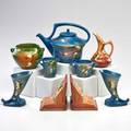 Roseville nine snowberry pieces blue teapot sugar and creamer two cornucopia vases green bulbous vase pink ewer and pair of bookends zanesville oh 1946 all marked teapot 8 x 10 dia