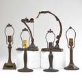 Handel etc two patinated metal lamp bases meridan ct early 20th c both marked and four similar bases student lamp base 13 12 tall