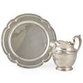 Gorham sterling holloware two pieces  helmet form water pitcher 024 marked gorham sterling 4 12 pint 8 12 salver with reeded and scalloped edge marked black starr and frost sterling