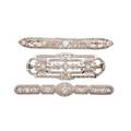 Three platinum or gold  diamond filigree brooches