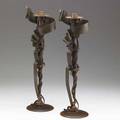 Albert paley pair of tall forged and fabricated steel millenium candlesticks each with a brass bobeche signed albert paley 2002 21 14 x 7 x 5 34